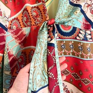 Colorful flowy tie-front blouse